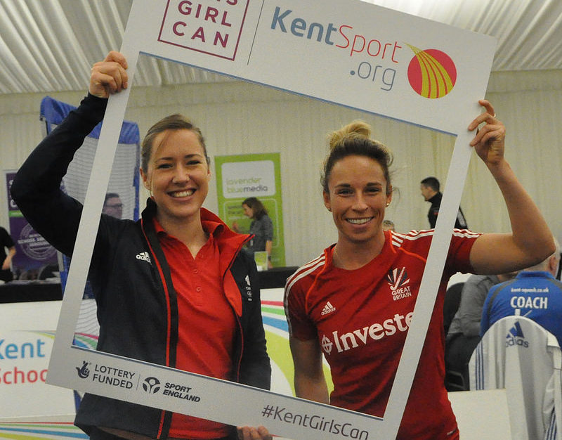 photo of Lizzie Yarnold holding a this girl can sign