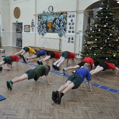 Children doing press up's in the hall