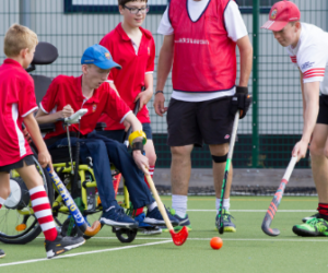 young people playing hockey