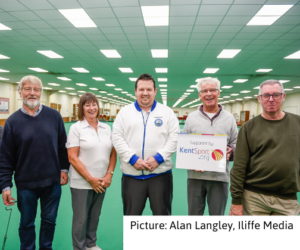 Members of Oyster Indoor Bowls Club holding a banner reading 'supported by Kent Sport'