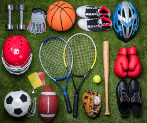 a range of equipment from different sports lying on the floor