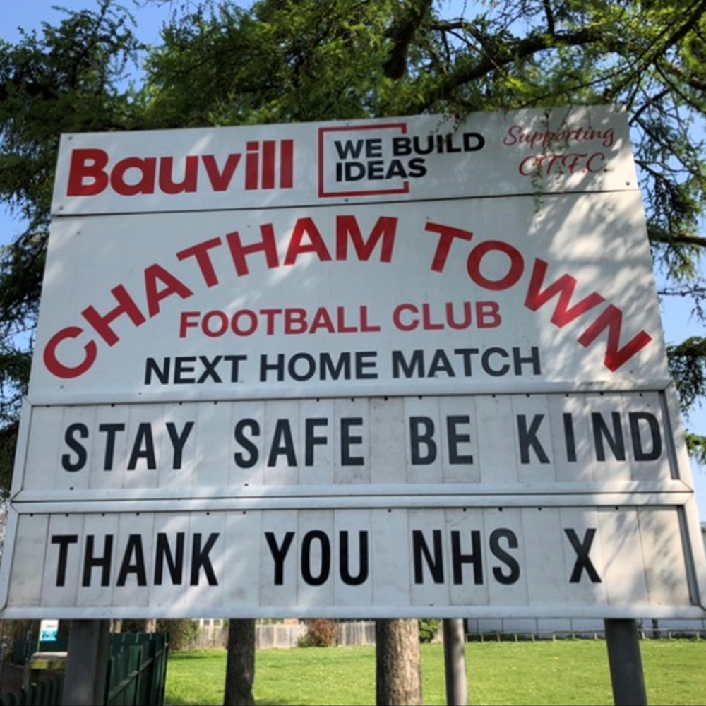 Chatham Town Football Club billboard at home ground. Stay Safe, be kind, thank you NHS.